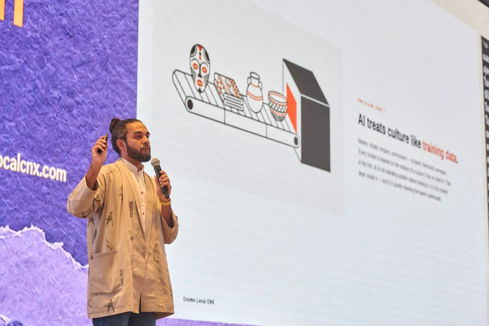 Siosi Samuels on stage at Cosmo Local CNX with a slide reading “AI treats culture like training data.”